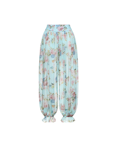 Evie, blue chiffon ruffled pants with a floral print