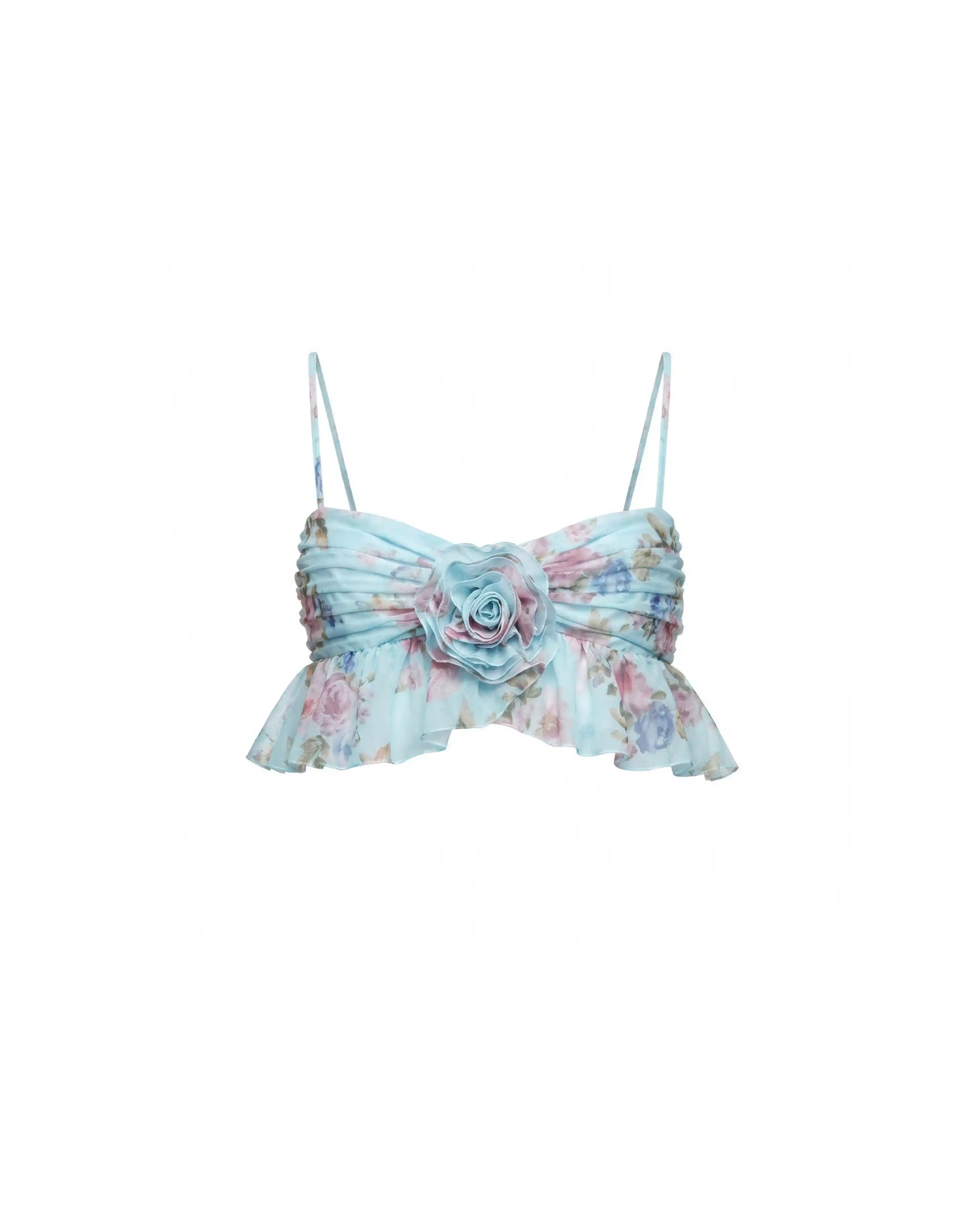 Willow, blue chiffon top with a floral print and a rose detail