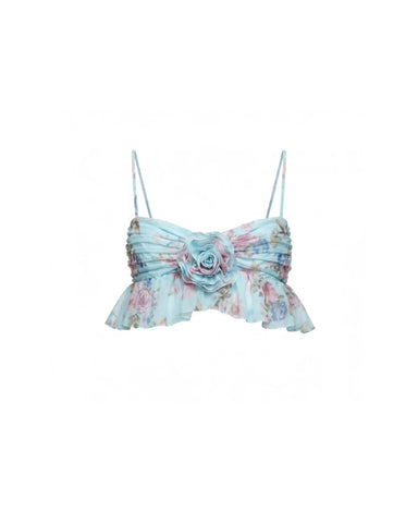 Willow, blue chiffon top with a floral print and a rose detail