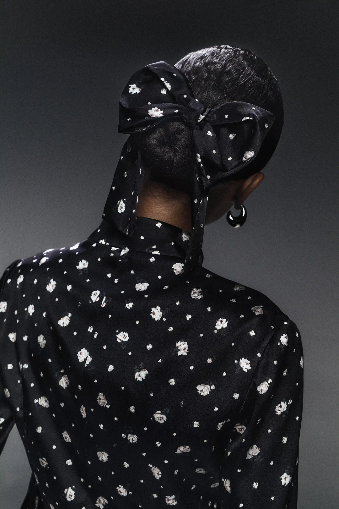 Mirella, hair bow made of black satin with small floral print