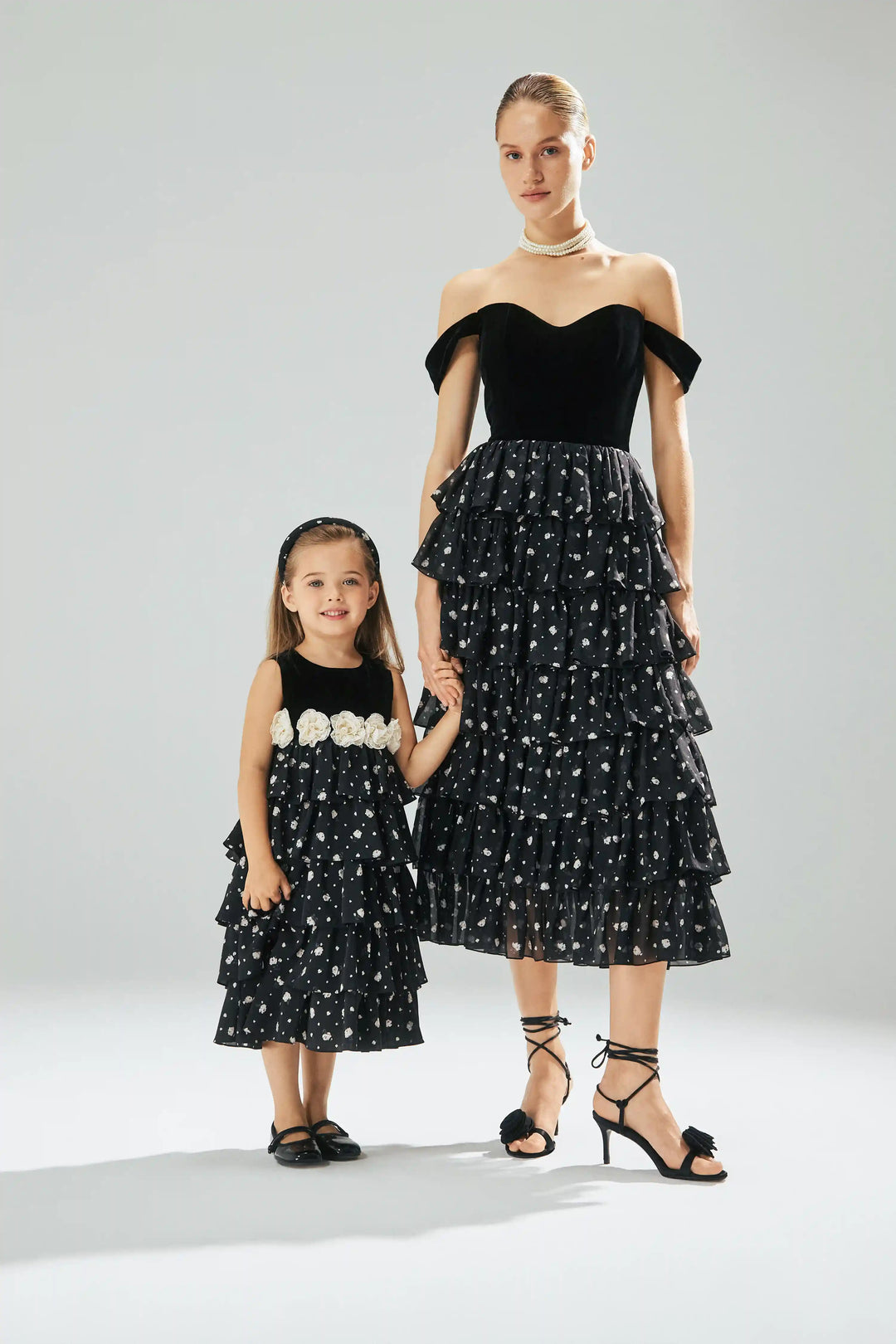 Kiki, children's dress made of black velvet and crepe de chine with small floral print