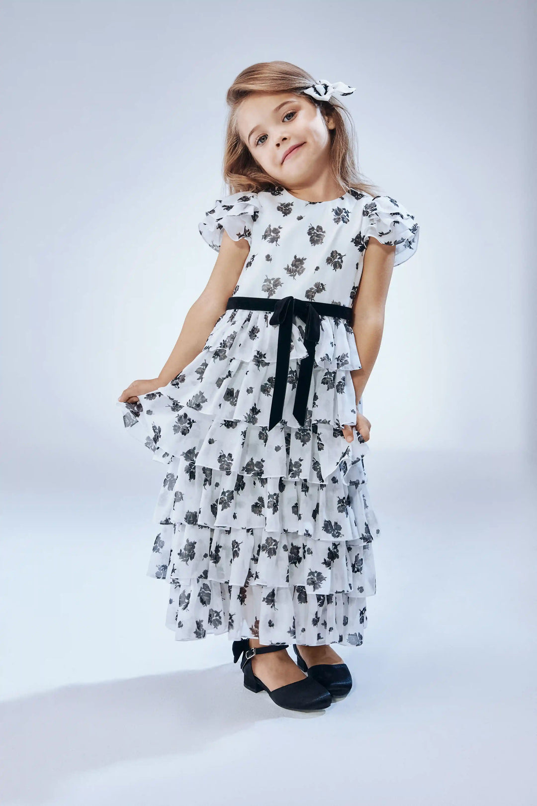 Ava, children's dress made of ivory chiffon with floral print, with a bow