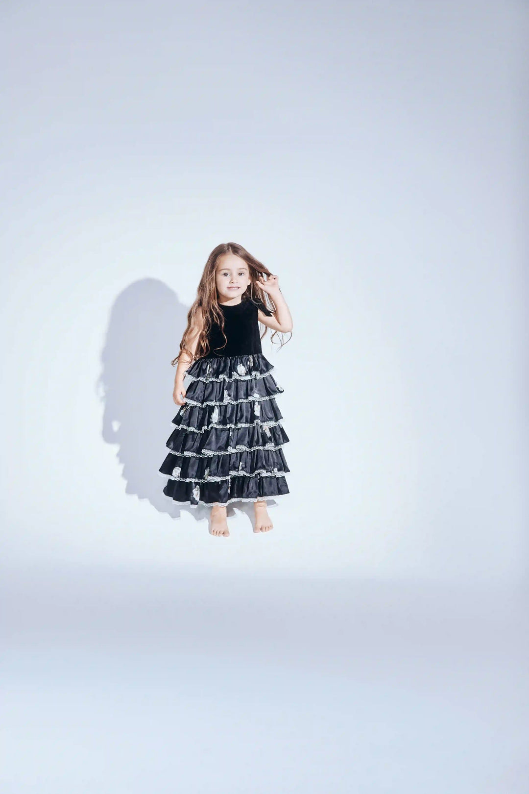 Ava no sleeves, children’s dress made of velvet and black satin with a floral print