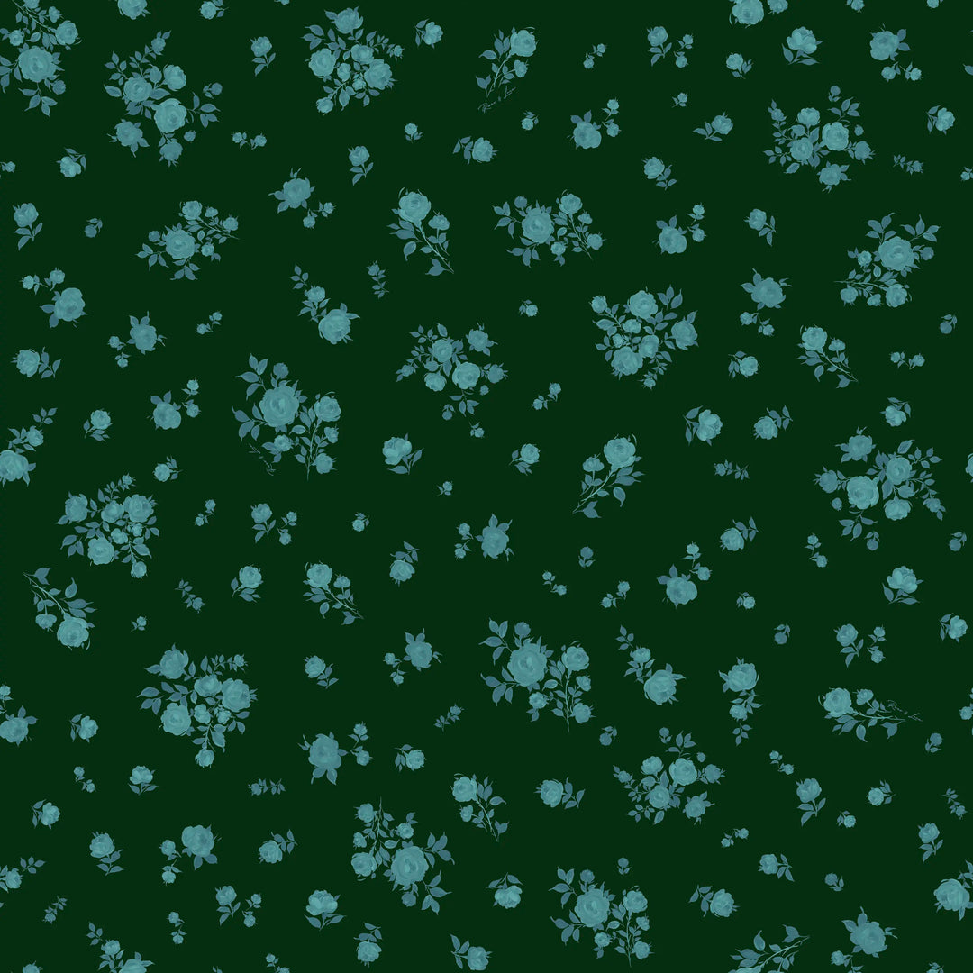 Ava, children’s dress made of dark green crepe de chine with a floral print