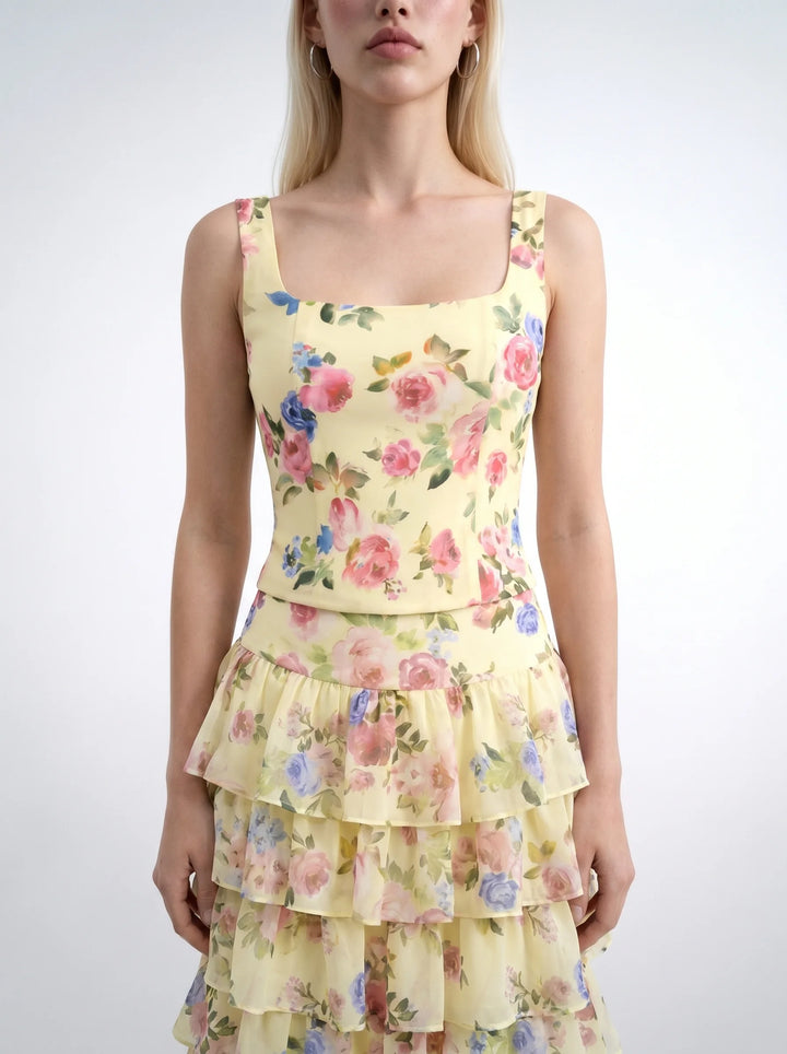 Vi, corset top with straps made of pale yellow crepe de chine with a floral print