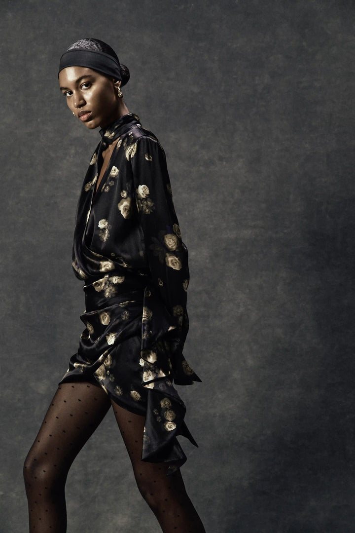Leah, mini dress madde of black satin with floral print