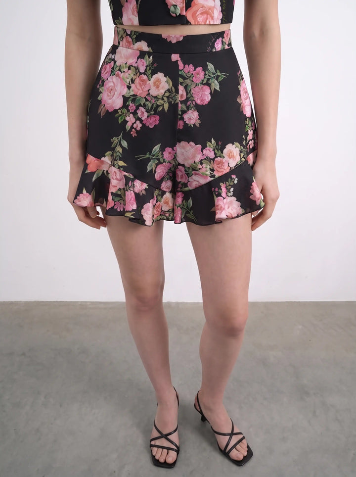 Audrie, mini shorts with ruffles in black crepe de chine with medium pink flowers