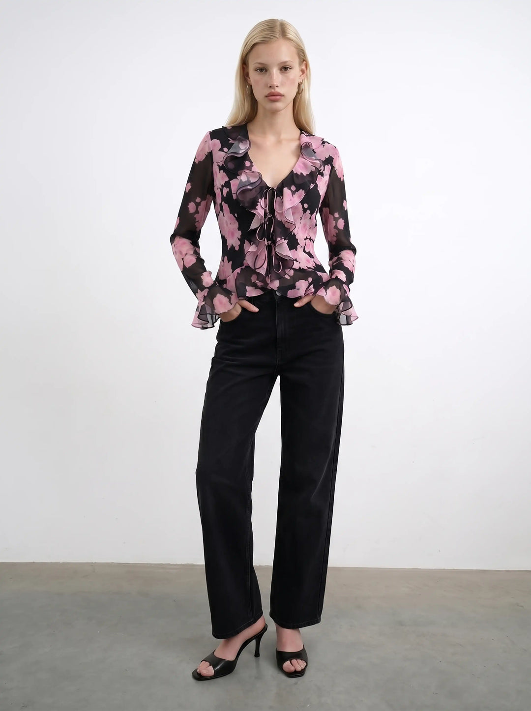 Ruzana, black chiffon blouse with sleeves and ruffles and large pink flowers