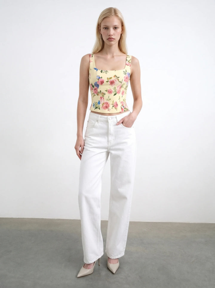 Vi, corset top with straps made of pale yellow crepe de chine with a floral print