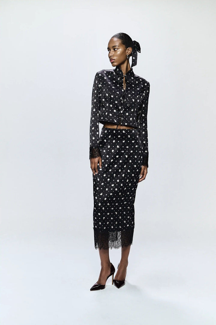 Chona, jacket made of black satin with small floral print