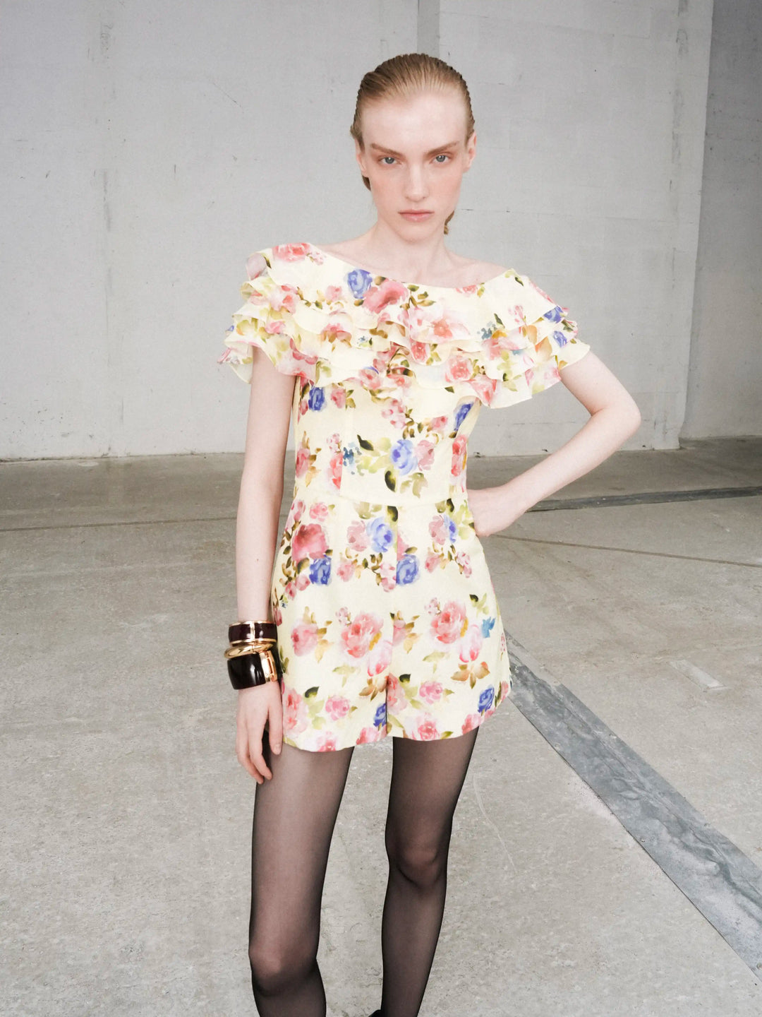 Abby, jumpsuit in pale yellow batiste with a floral print