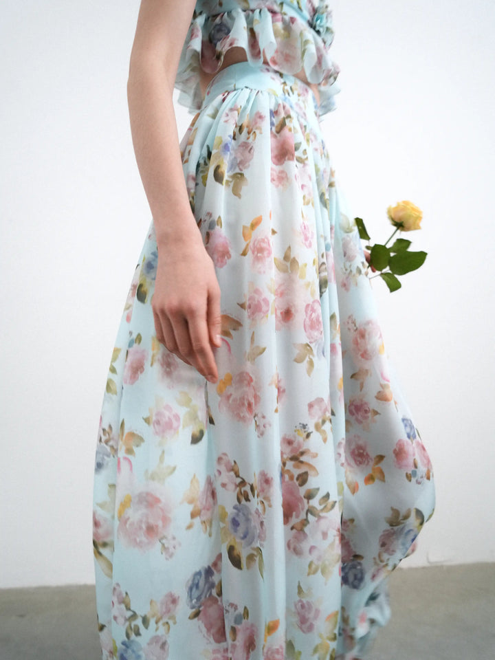 Evie, blue chiffon ruffled pants with a floral print