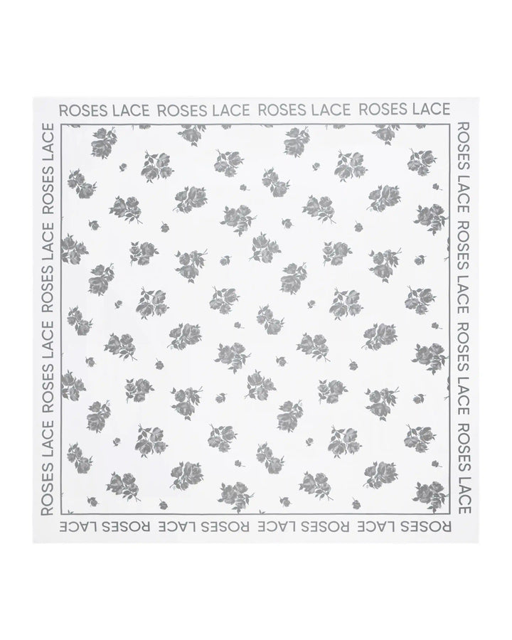 Gill, set of two-piece swimsuit and pareo made of biflex in ivory with floral print