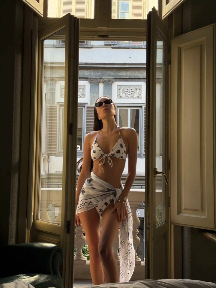 Gill, set of two-piece swimsuit and pareo made of biflex in ivory with floral print