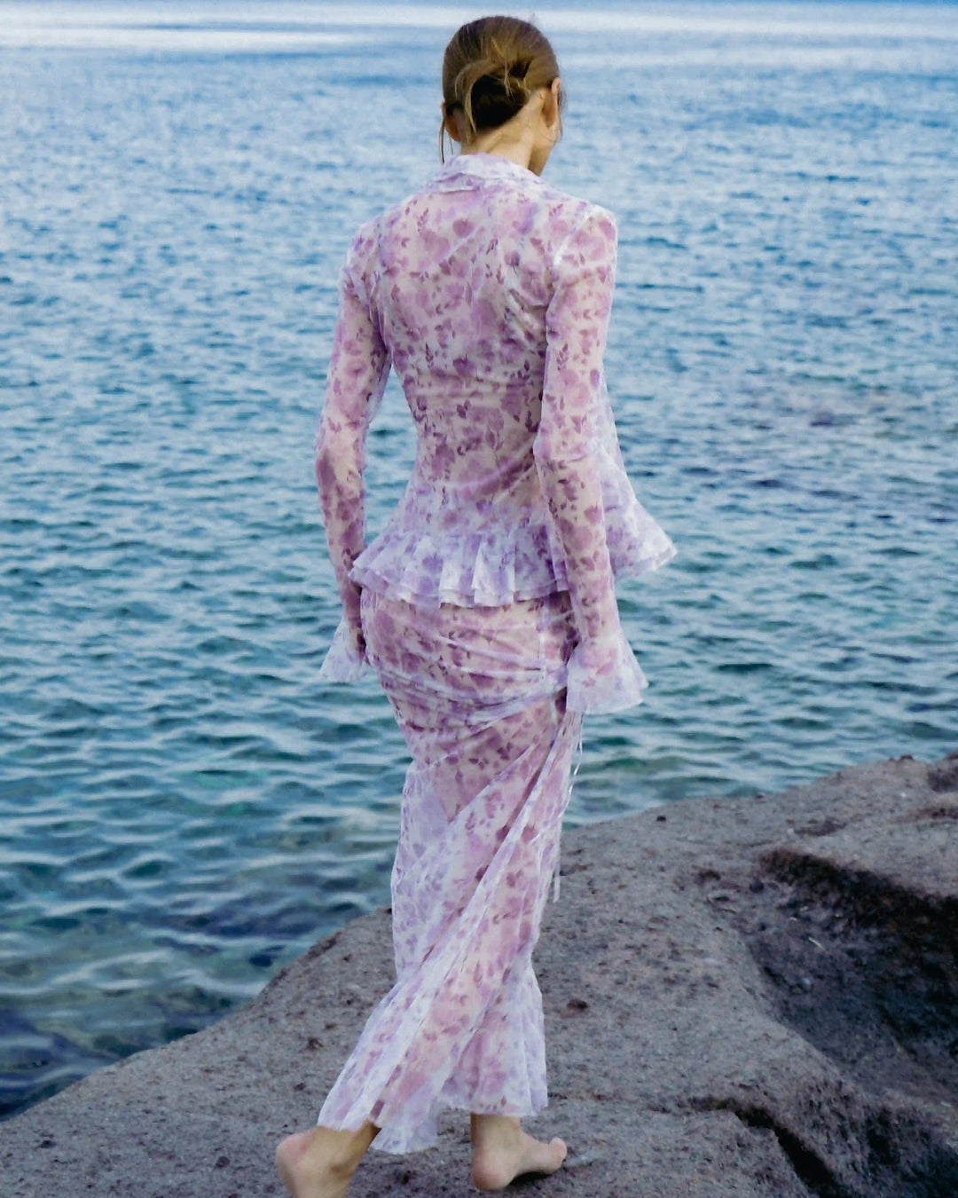 Roxanna mesh, beach blouse with sleeves and ruffles made of ivory mesh with medium lilac flowers