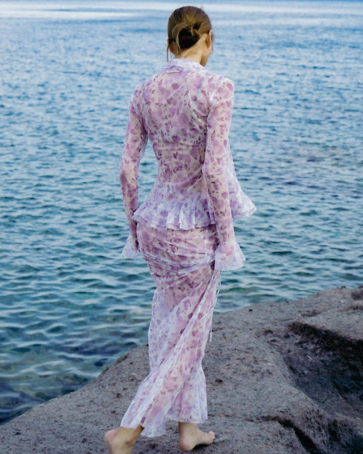 Roxanna mesh, beach blouse with sleeves and ruffles made of ivory mesh with medium lilac flowers